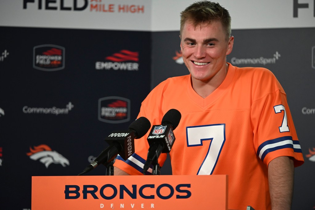 Denver Broncos quarterback Bo Nix jokes with reporters after an NFL football game, Sunday, Oct. 6, 2024, in Denver.