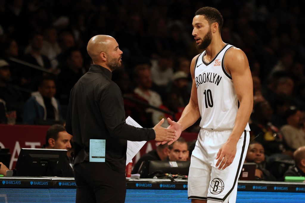 The Nets' Ben Simmons (right) shakes hands with coach Jordi Fernandez in the second half during a preseason game against the Raptors on Friday.