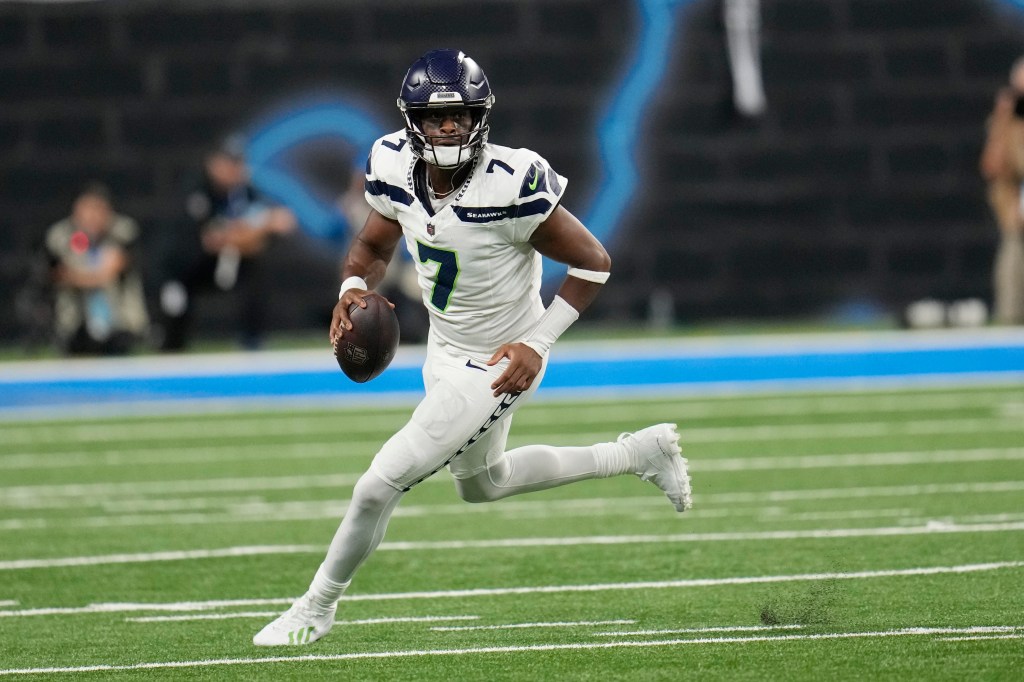 Seattle Seahawks quarterback Geno Smith scrambles during the first half of an NFL football game against the Detroit Lions, Monday, Sept. 30, 2024, in Detroit.