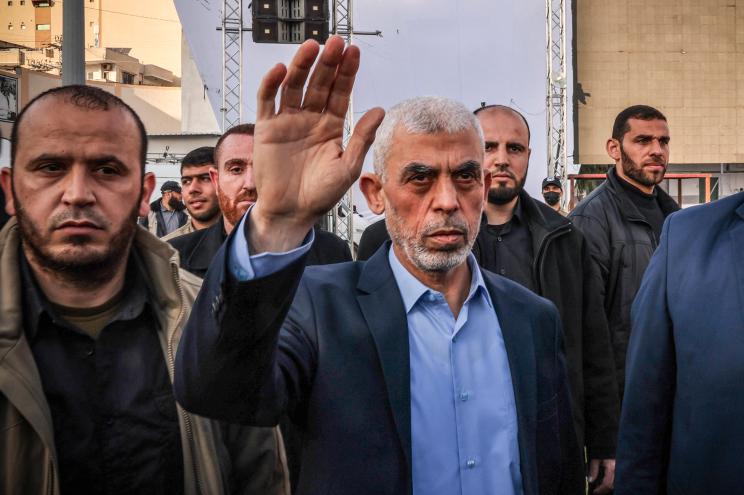 Yahya Sinwar waves to supporters as he arrives to attend a rally marking Al-Quds Day, a commemoration in support of the Palestinian people celebrated annually on the last Friday of the Muslim fasting month of Ramadan, in Gaza City, on April 14, 2023.