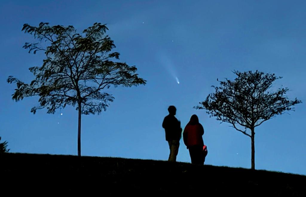 The new comet, Comet C/2024 S1, will prospectively be visible during daytime, astronomers say. Stargazers are seen viewing recent Comet C/2023 A3 Tsuchinshan.