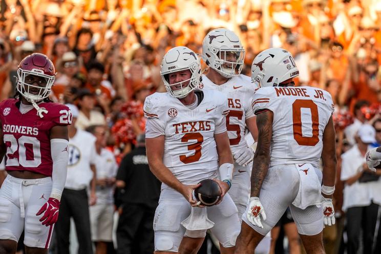 Texas Longhorns quarterback Quinn Ewers (3) celebrates a touchdown run during the Red River Rivalry game against Oklahoma at the Cotton Bowl on Saturday, Oct. 12, 2024 in Dallas, Texas.