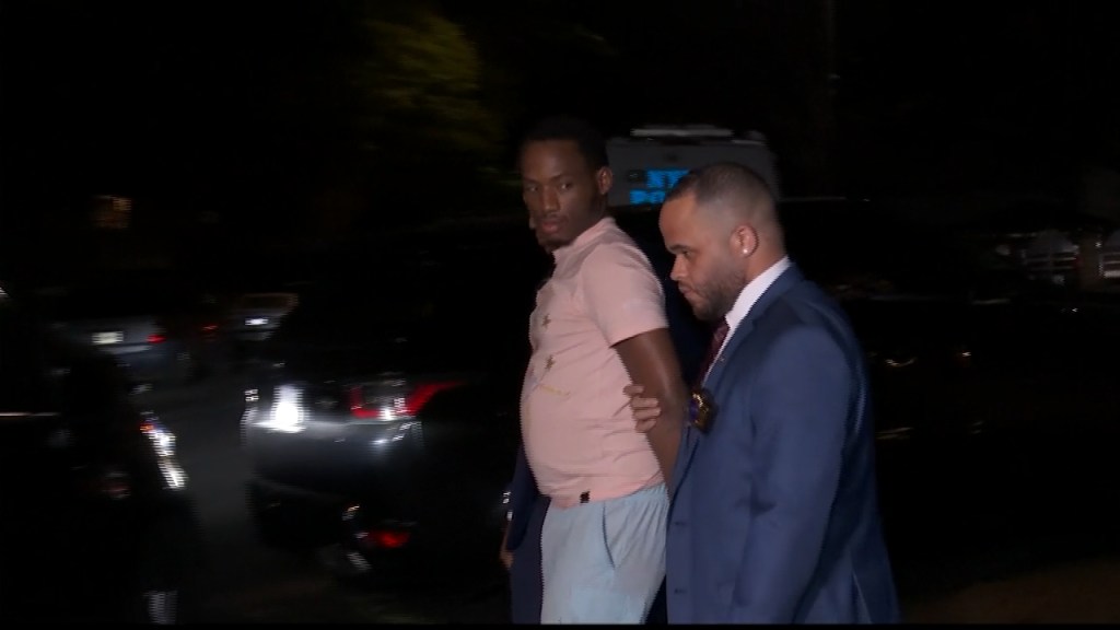 Ishmael Francis being escorted out of the Bronx Special Victims Unit by police