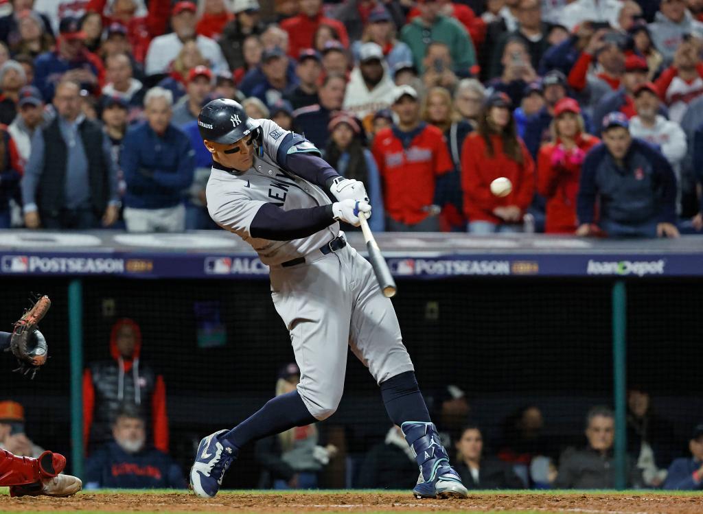 Aaron Judge #99 of the New York Yankees hits a two-run home run during the 8th inning of ALCS game 3 at Progressive Field