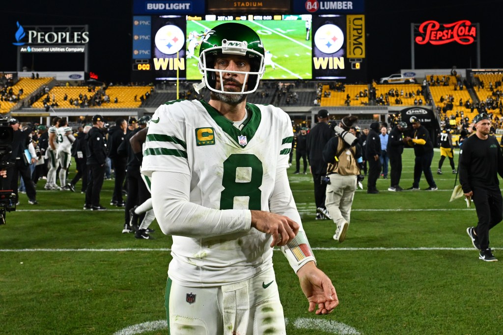 Aaron Rodgers #8 of the New York Jets walks off the field after a loss to the Pittsburgh Steelers