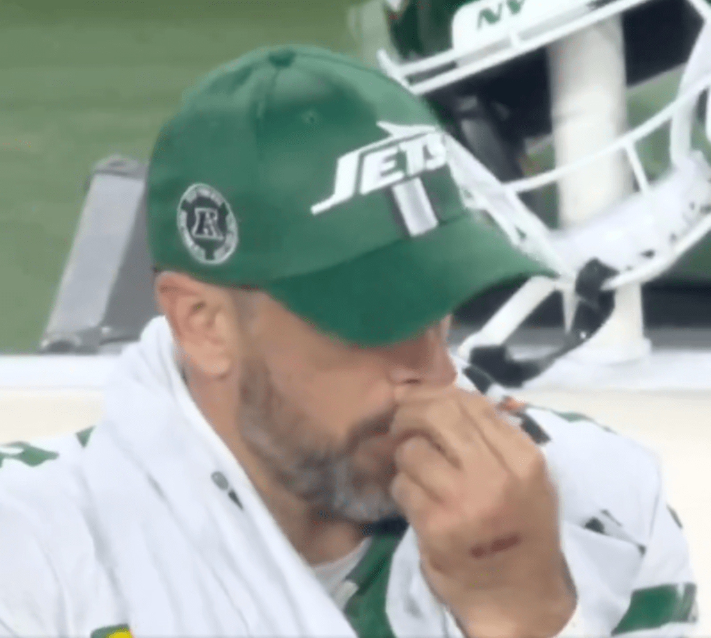 Aaron Rodgers takes a try at his nose during the Jets blowout loss. 