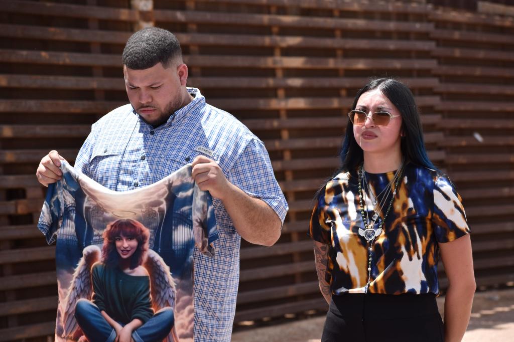 Alexis Nungaray standing along the border wall during a visit with former President Donald Trump