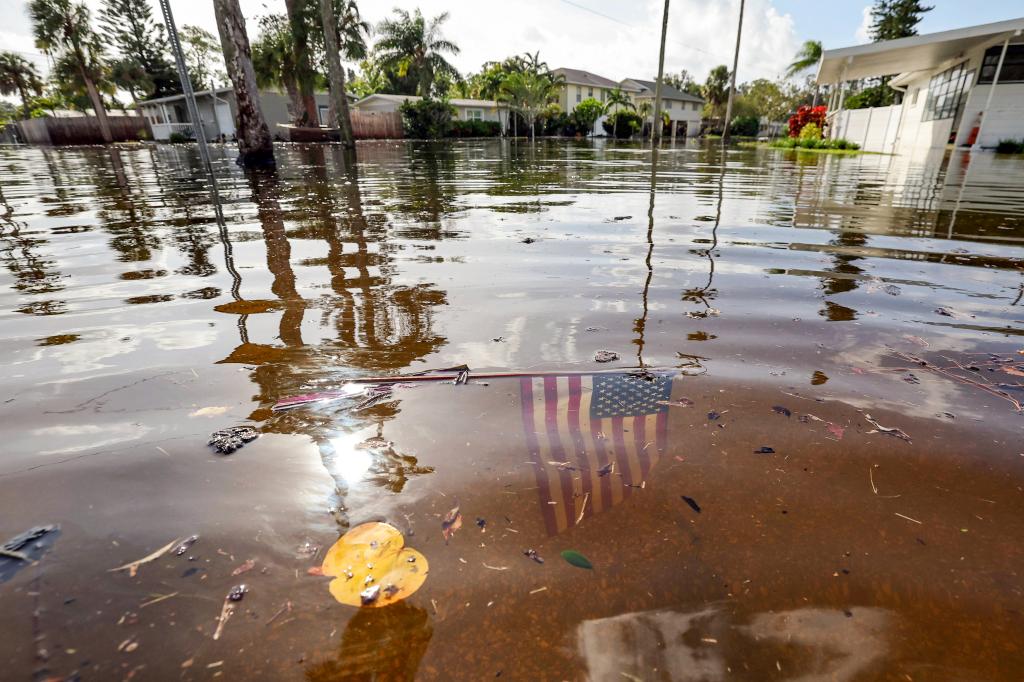 American flag immersed in floodwaters in the Shore Acres neighborhood of St. Petersburg, Florida, following Hurricane Helene