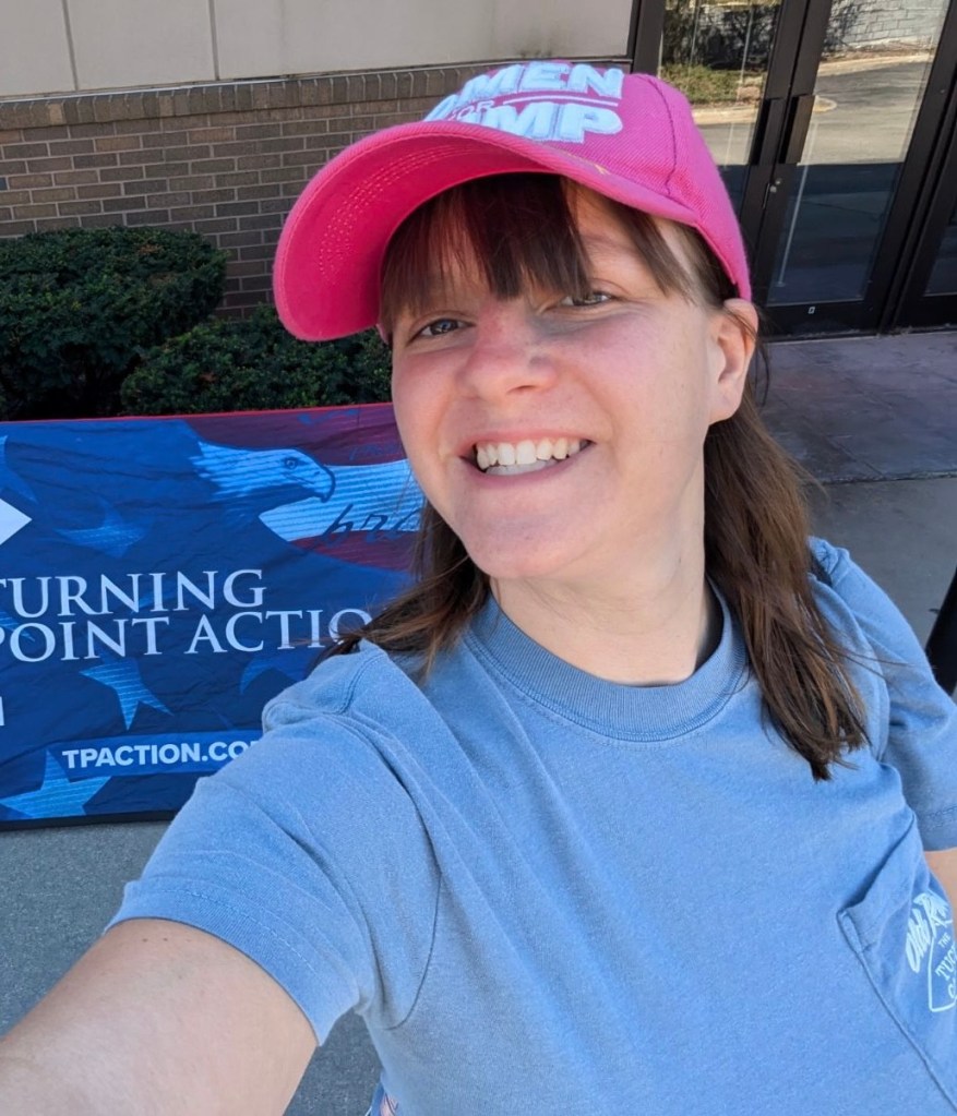 Amy Teutenberg, a Wisconsin voter, smiling and wearing a pink hat
