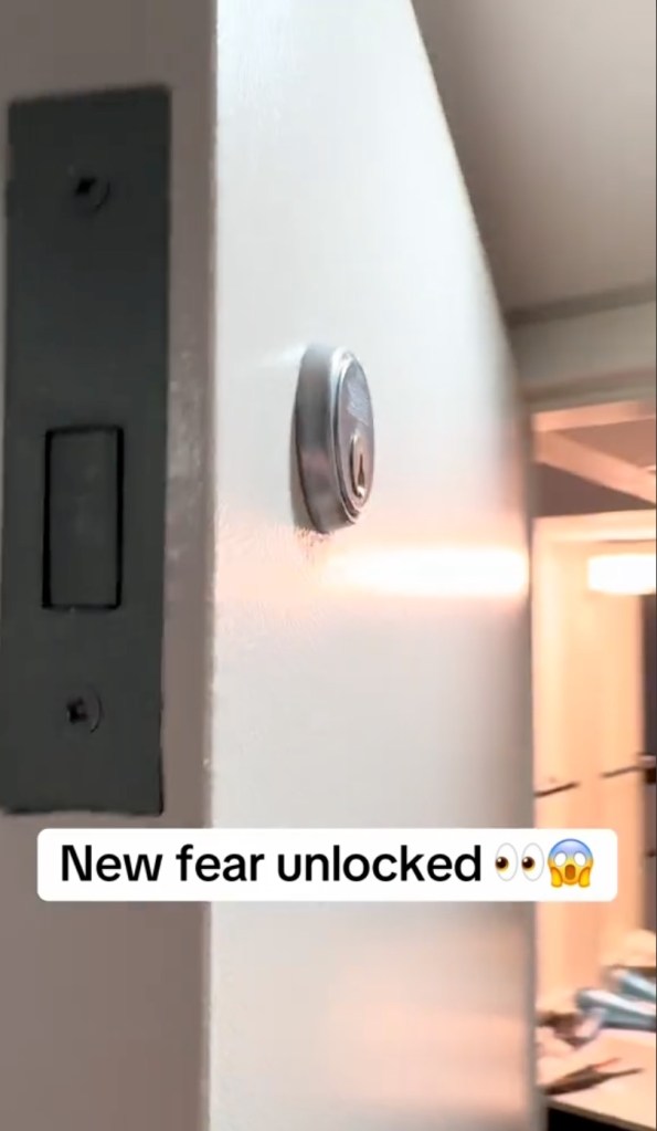 Different view of man discovering an unusual door lock on a hotel bathroom door