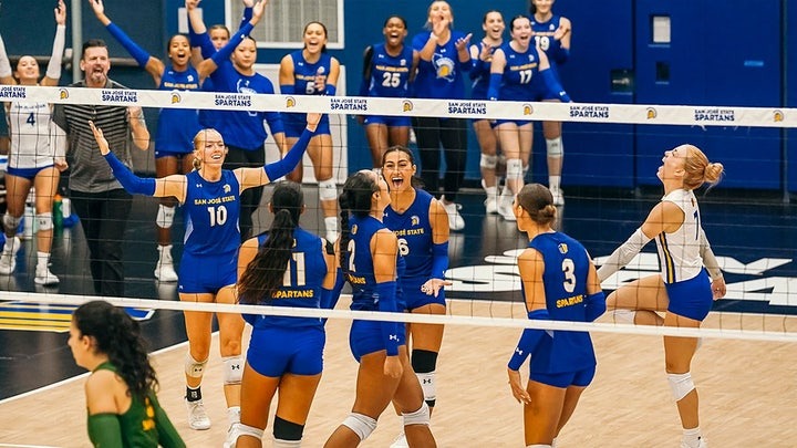 The San Jose State University women's volleyball team during a match. 