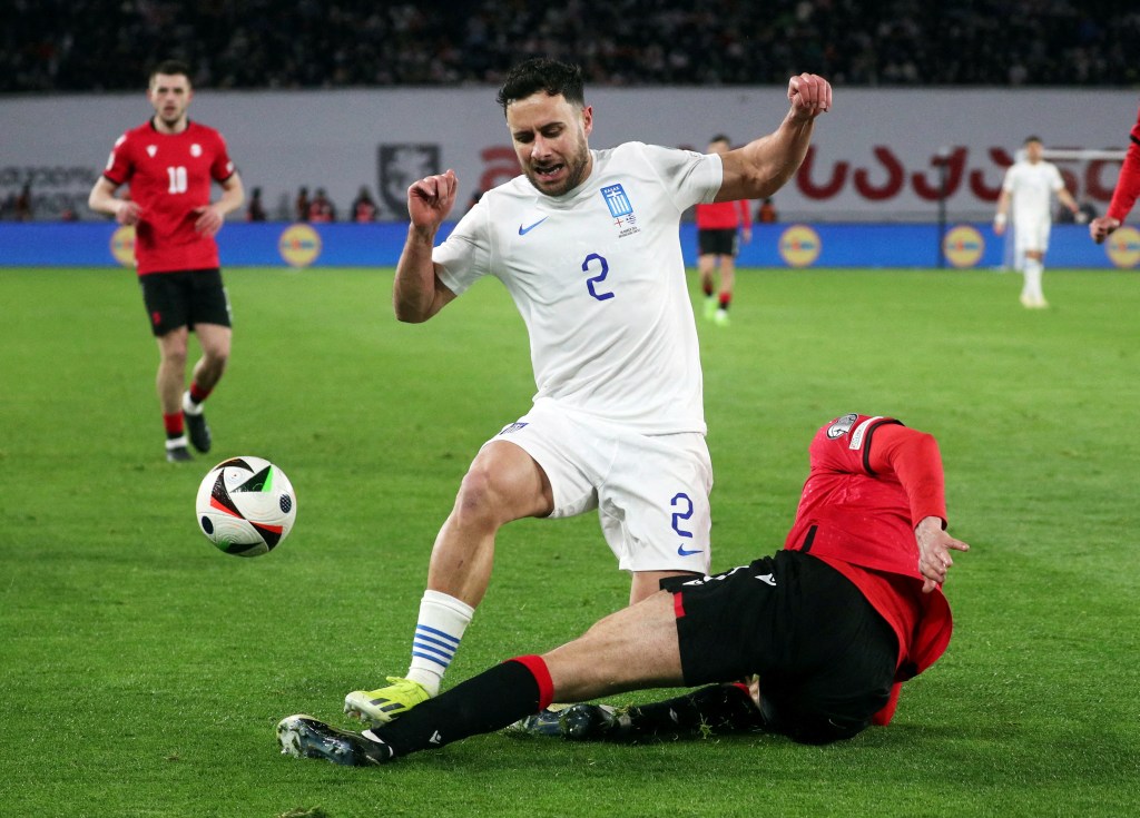 Greece's George Baldock in action with Georgia's Lasha Dvali