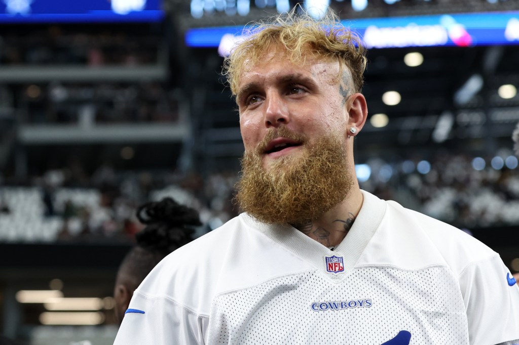 oxer and influencer Jake Paul walks on the field before a game between the New Orleans Saints and Dallas Cowboys