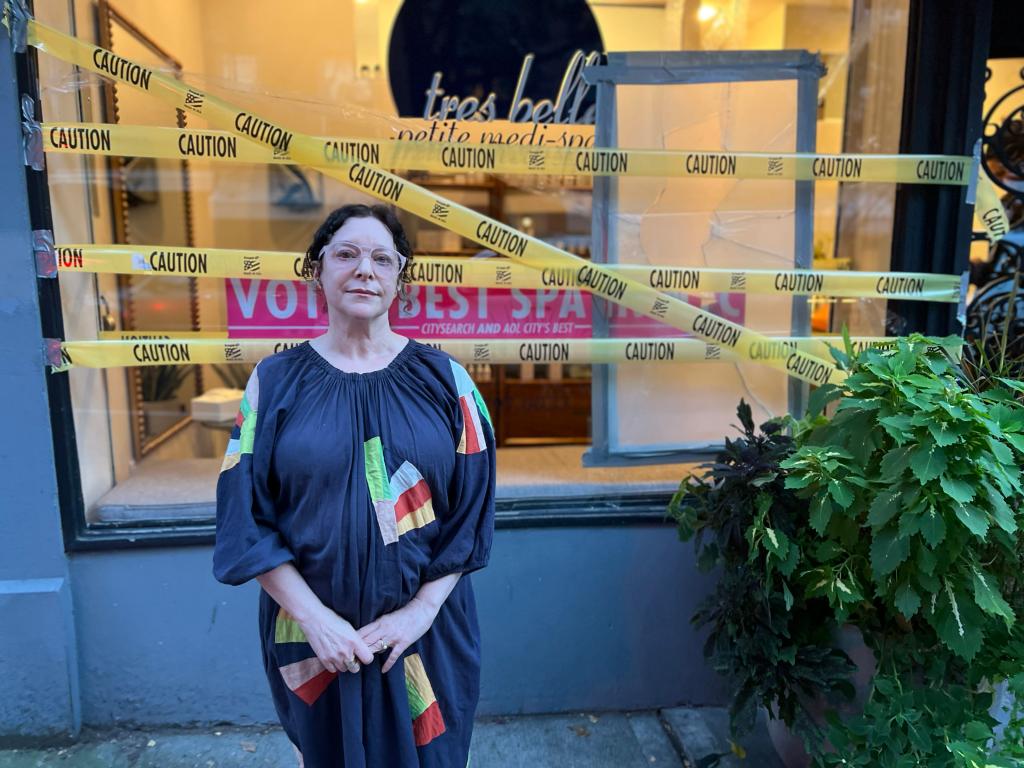 Allison Tray in front of her vandalized spa