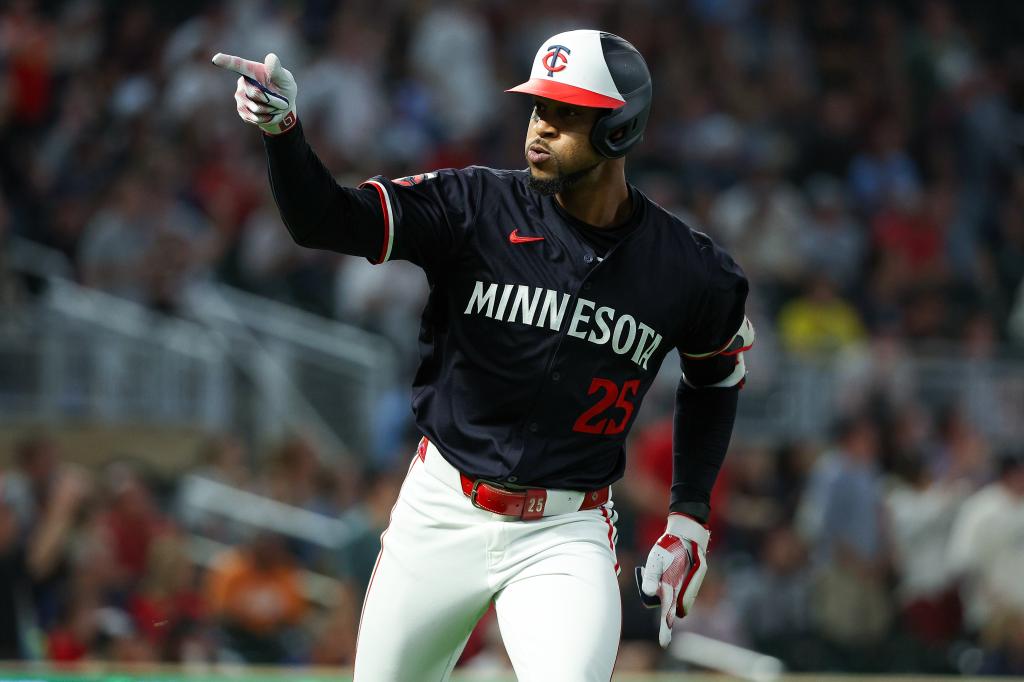 Byron Buxton #25 of the Minnesota Twins celebrates his solo home run as he runs the bases against the Miami Marlins during the fourth inning at Target Field on September 25, 2024 in Minneapolis, Minnesota. 