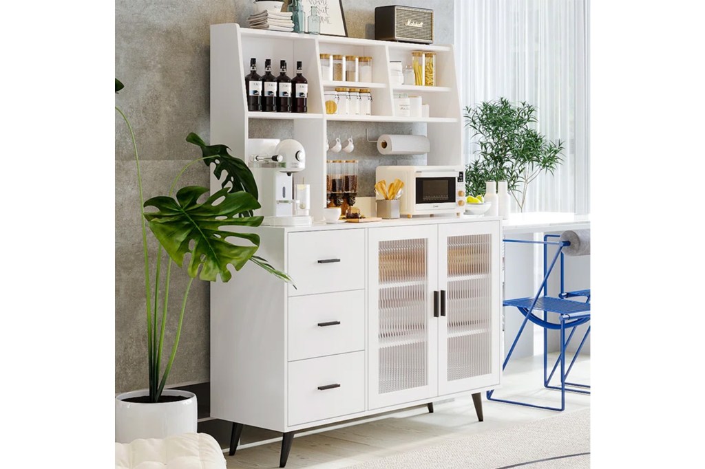 A white cabinet with shelves and a blue chair