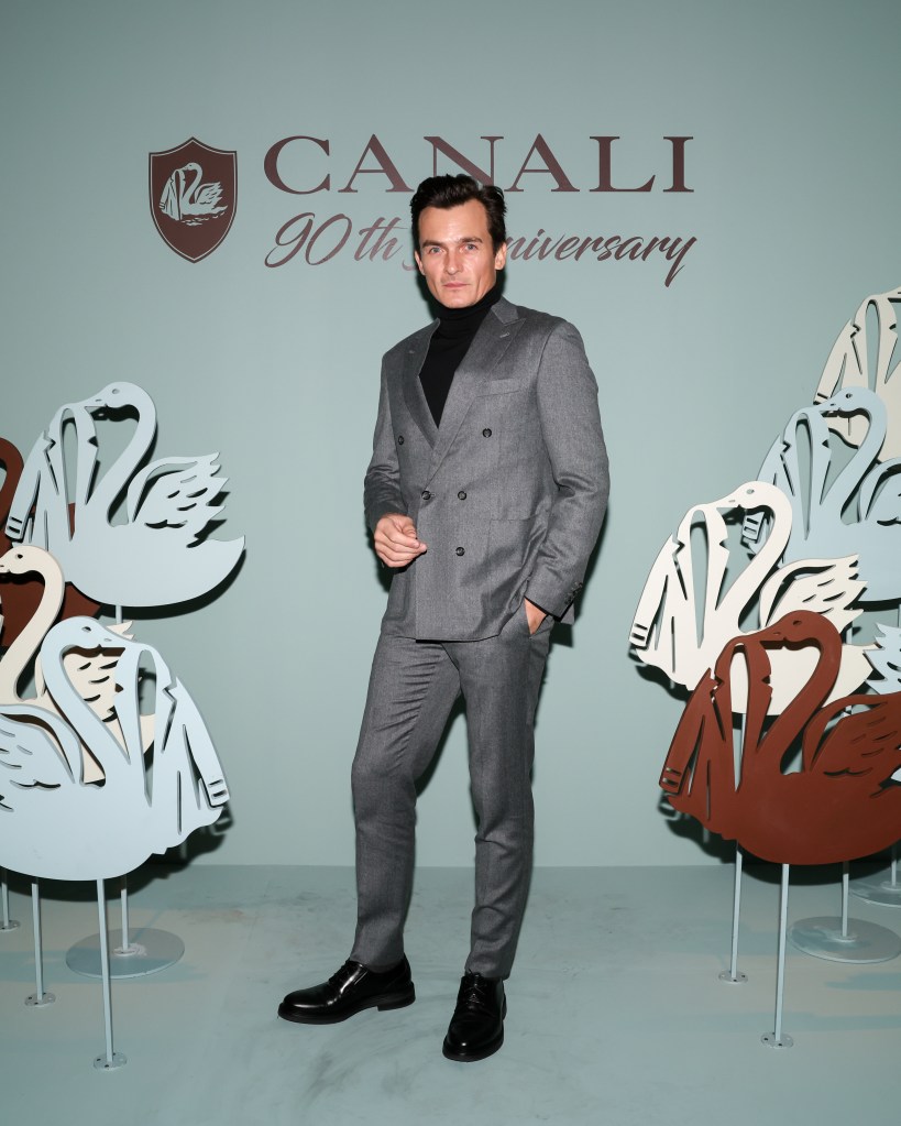 Actor Rupert Friend wearing a grey suit at Canali 90th Anniversary Party in New York