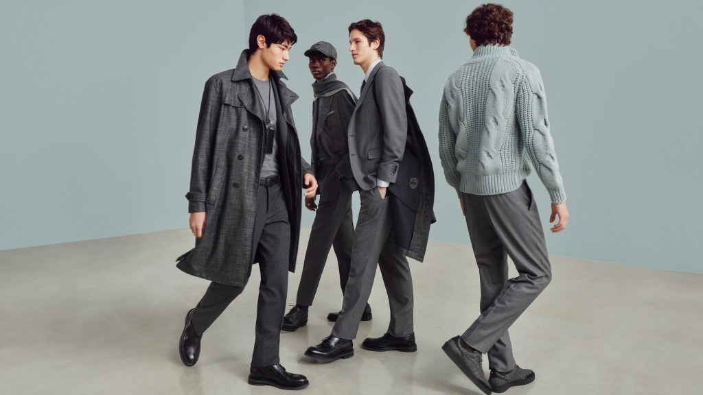 A group of men in grey coats at Canali's 90th Anniversary celebration