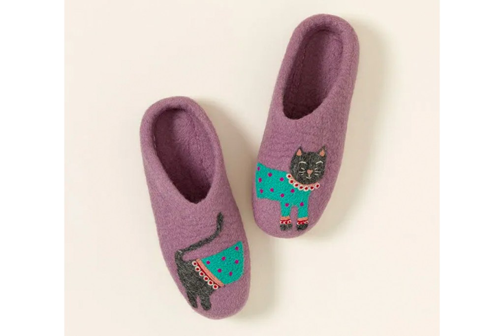 A pair of purple slippers with a cat design