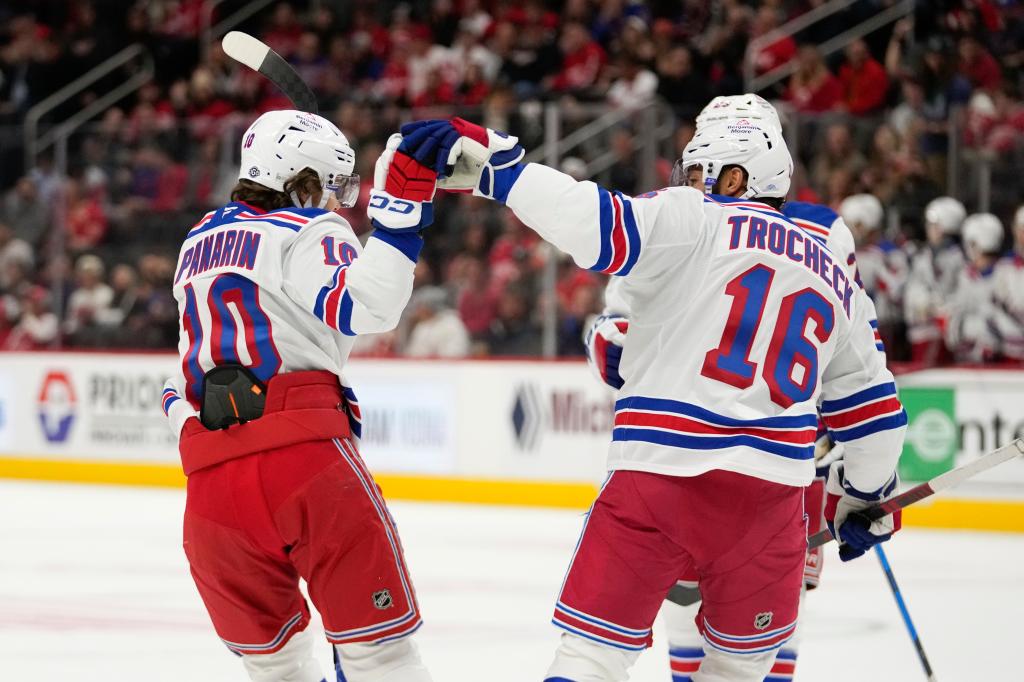 Artemi Panarin and Vincent Trocheck of New York Rangers celebrating a goal against the Detroit Red Wings in a NHL hockey game