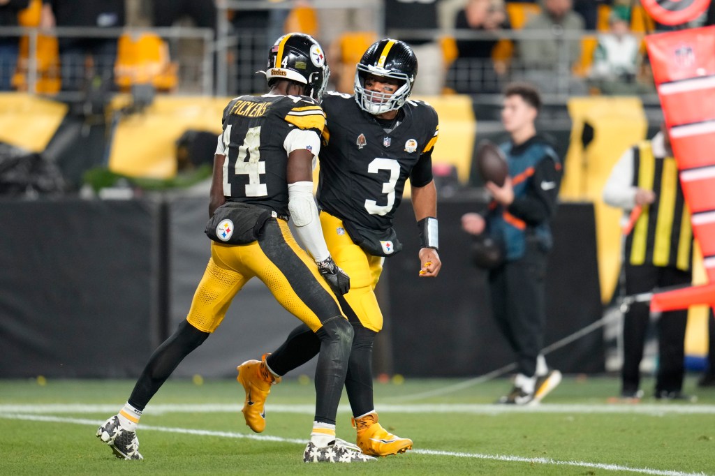 Wilson celebrates his touchdown pass to George Pickens.