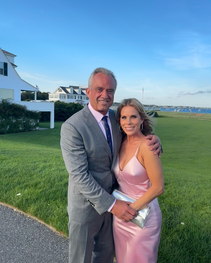 Robert F. Kennedy Jr. and Cheryl Hines posing for a picture on a windy day in Cape Cod