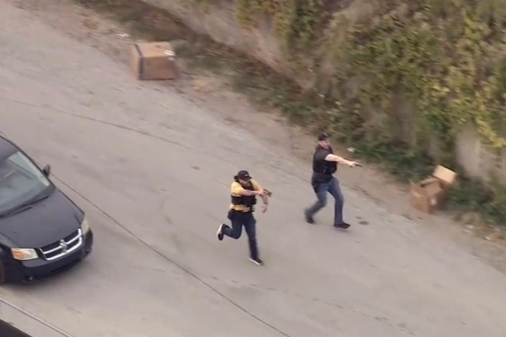 Chicago Police Department officers arrived on scene, guns drawn, as apparent thieves attempted to flee the scene.