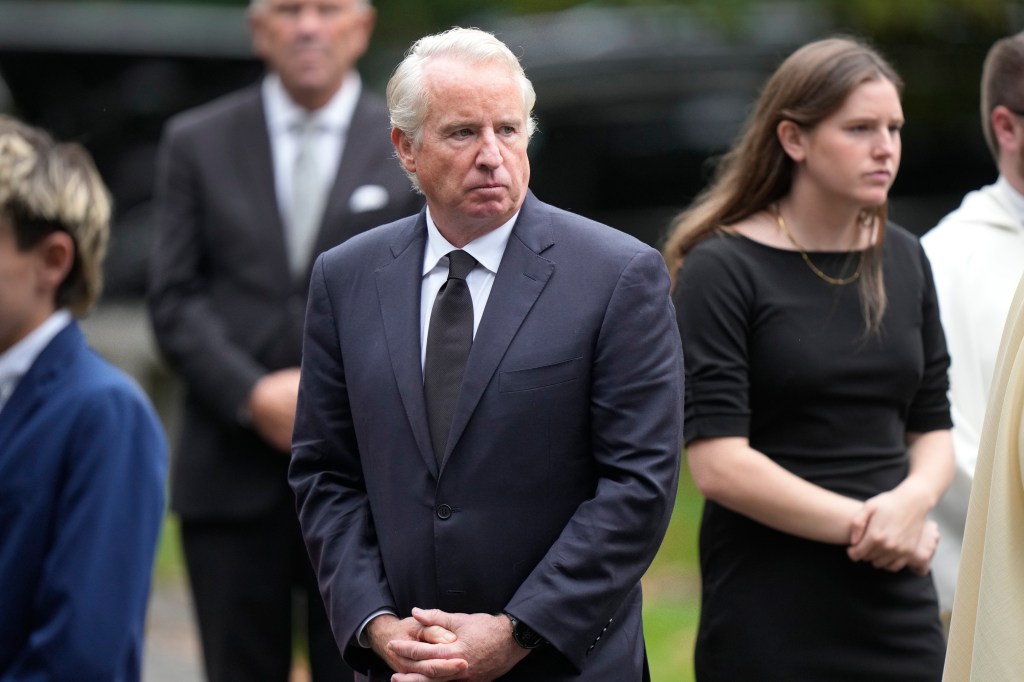 Chris Kennedy in a suit and tie leaving Our Lady of Victory church after the funeral service of Ethel Kennedy