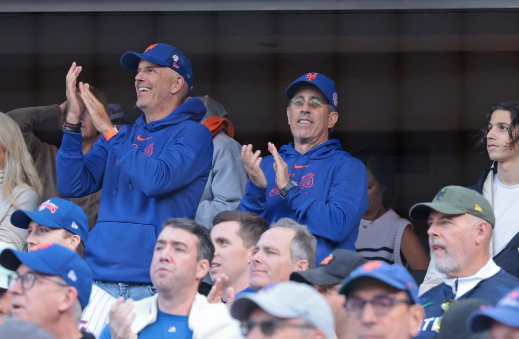 Comedian Jerry Seinfeld cheers on with fans as the Mets introduce their starting lineup.