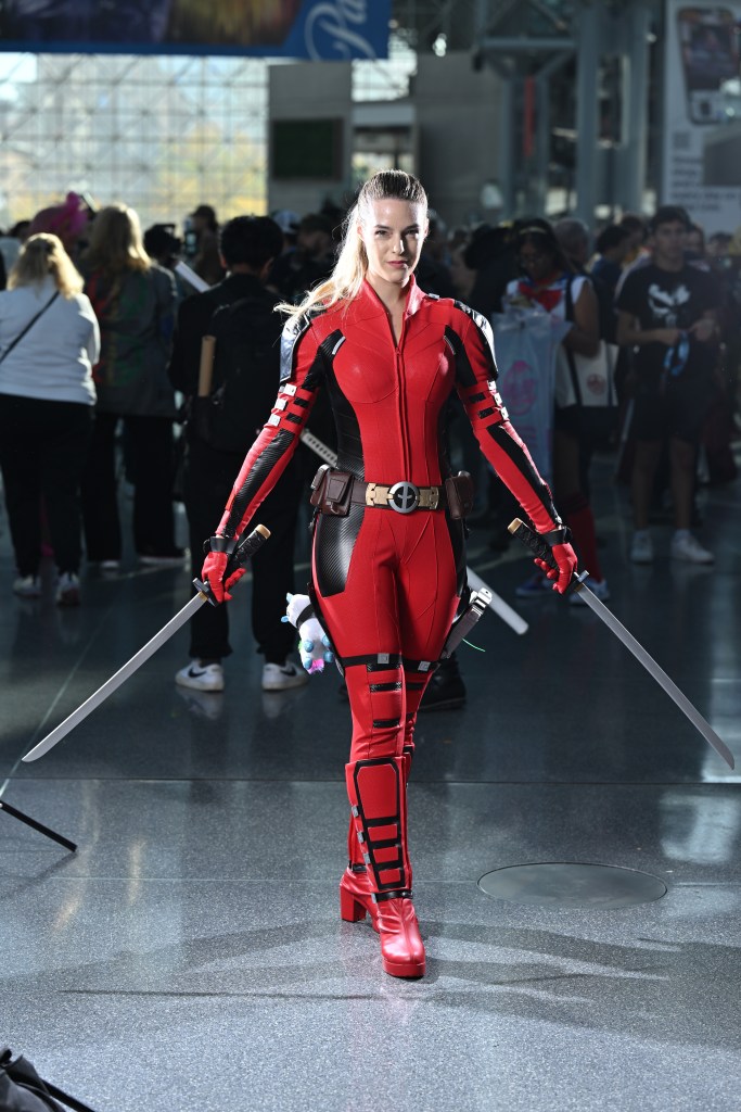 Cosplayer dressed as Deadpool posing at the New York Comic Con 2024