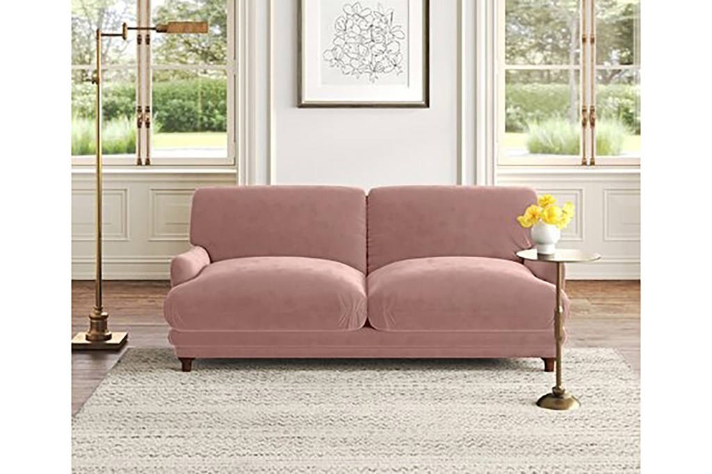 A pink couch in a room