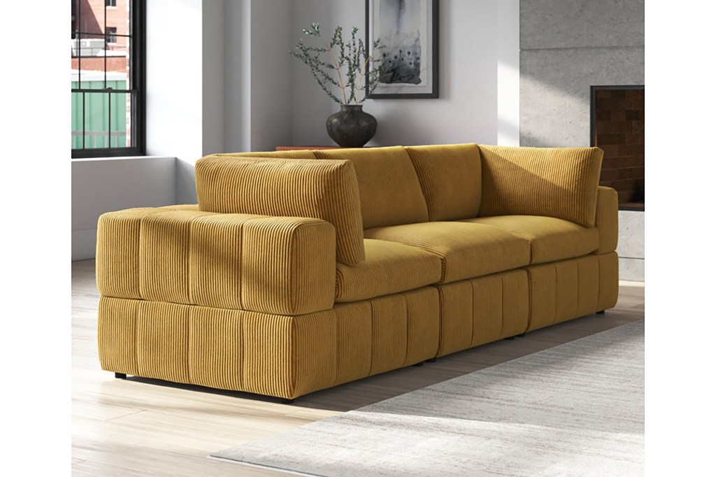 A yellow couch in a room