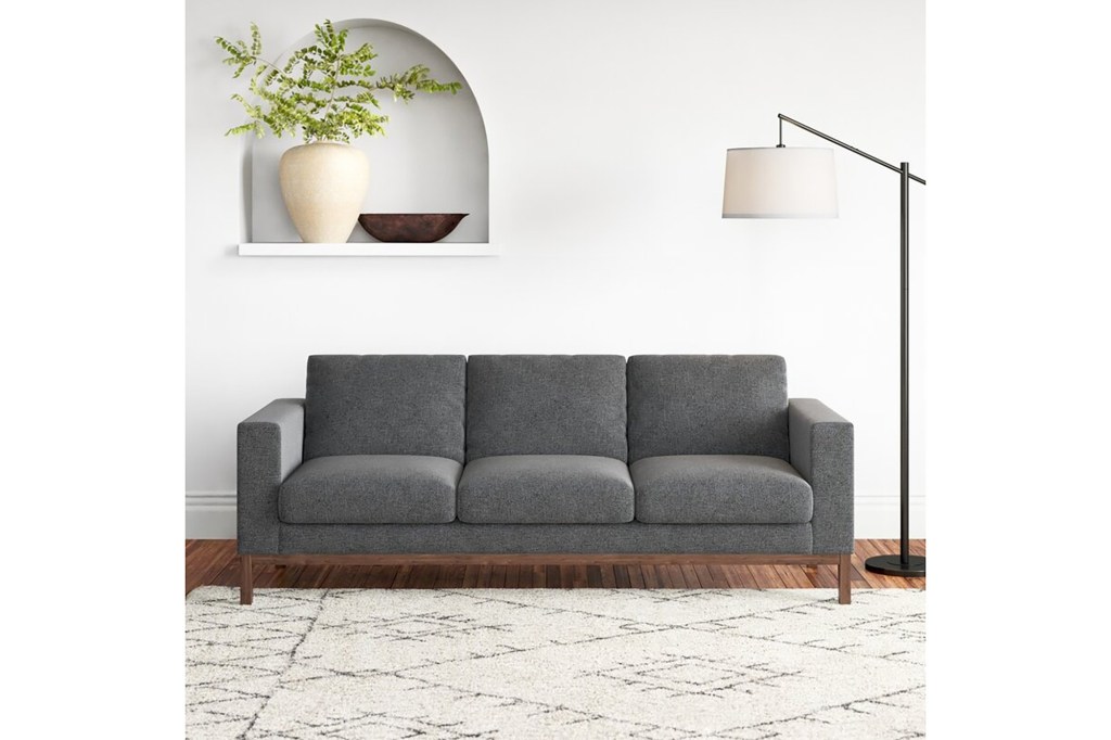 A grey couch in a room