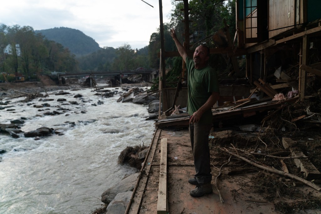 Curtis McCart, 58, stands in whats left of his home in of Bat Cave, North Carolina