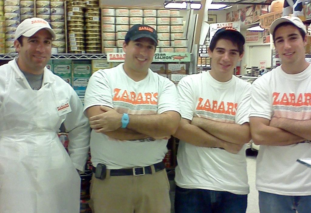 Daniel Zabar, Benjamin Zabar, WIllie Zabar, and Michael Zabar posing in the family's store in 2011.