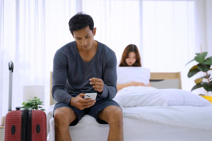 Young couple fighting in bedroom. Bad time and problem couple.