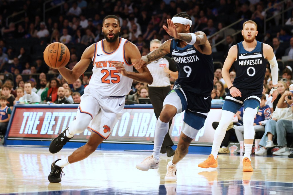 Knicks' Mikal Bridges (25) is defended by Minnesota Timberwolves guard Nickeil Alexander-Walker