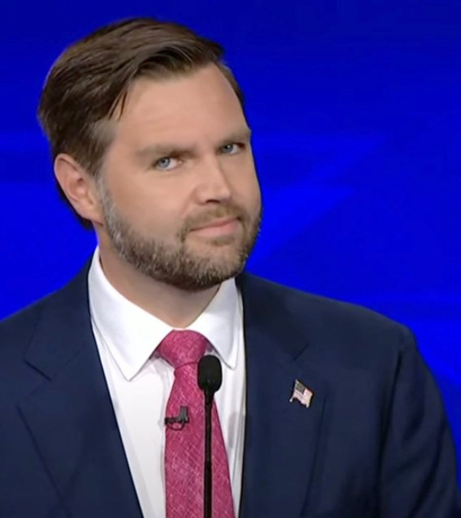 JD Vance looks towards the camera during Tuesday night's debate against Minnesota Gov. Tim Walz.