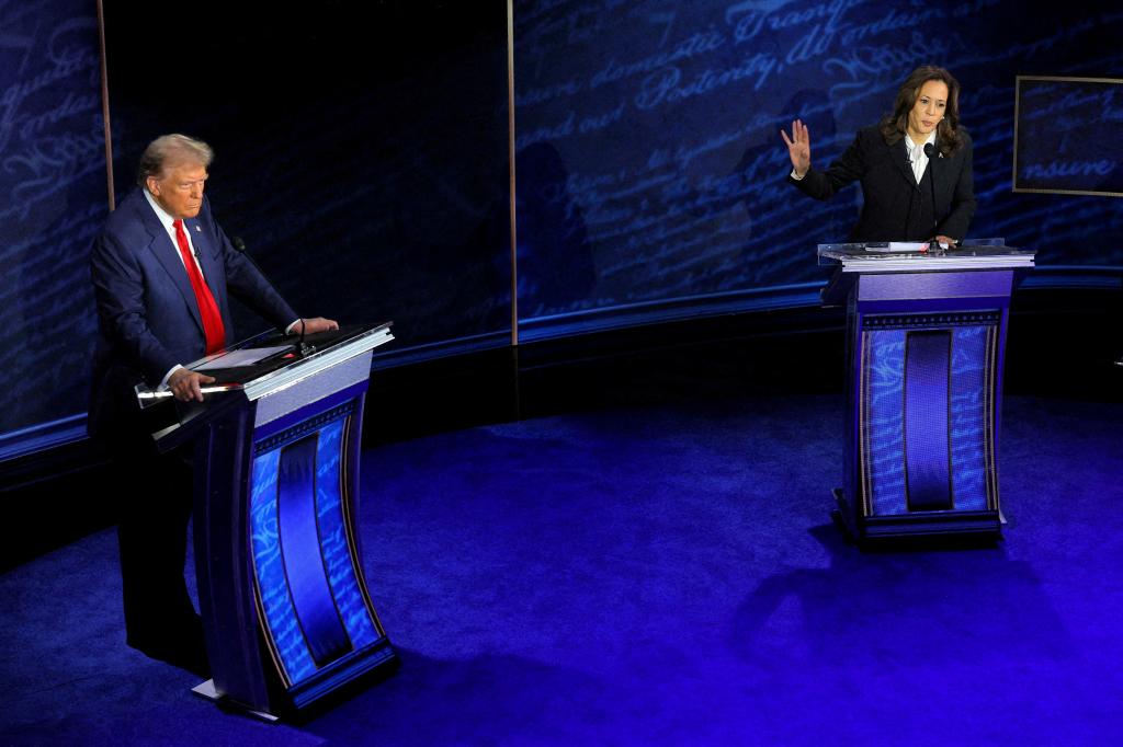 Democratic presidential nominee, Vice President Kamala Harris speaking at a debate while Republican nominee, former President Donald Trump listens, in Philadelphia, Pennsylvania, 2024.