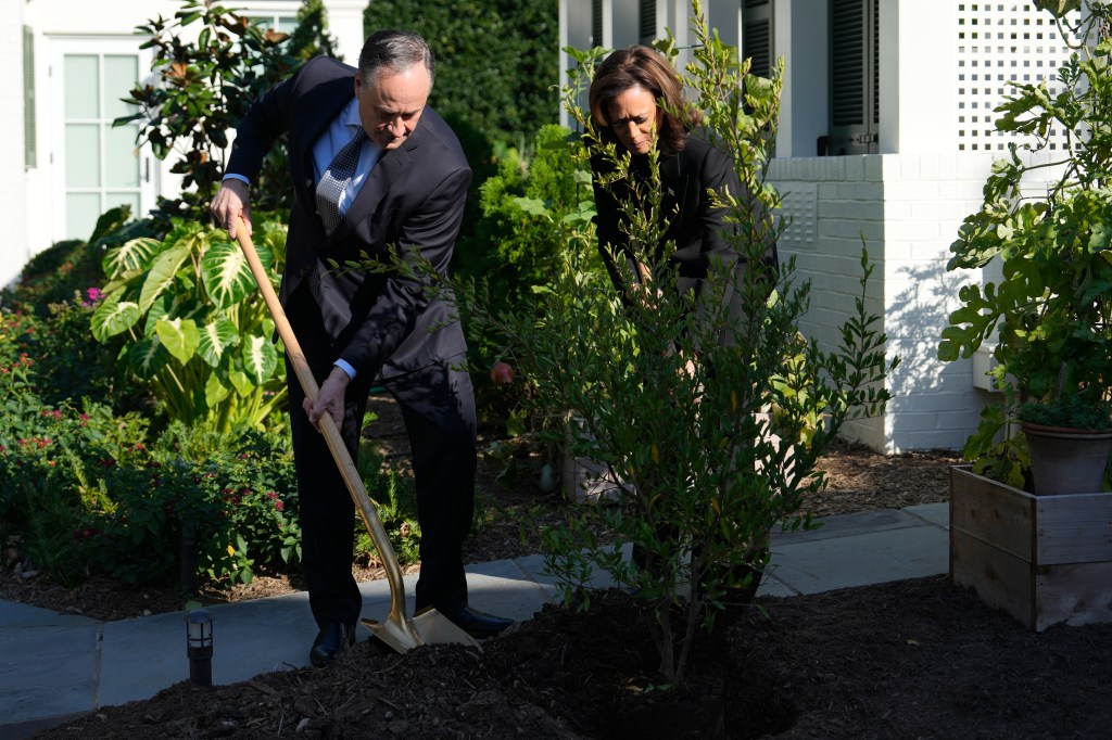 Vice President Kamala Harris and second gentleman Doug Emhoff planting a memorial tree to honor victims of a past attack