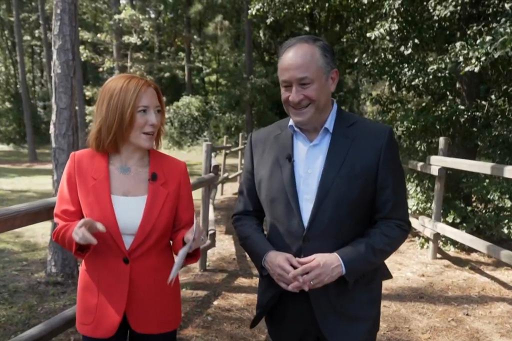 Doug Emhoff and Jen Psaki walking.