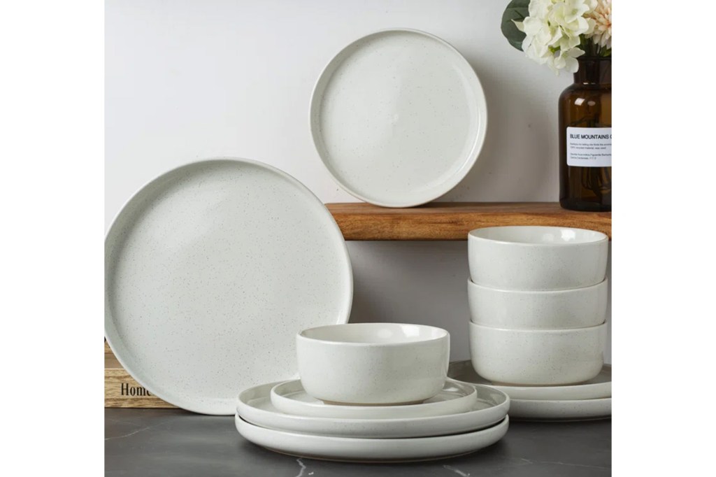 A group of white plates and bowls