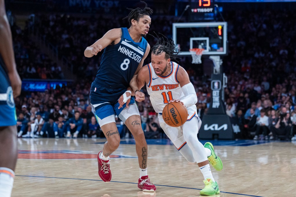 Knicks guard Jalen Brunson (11) drives around Minnesota Timberwolves forward Josh Minott