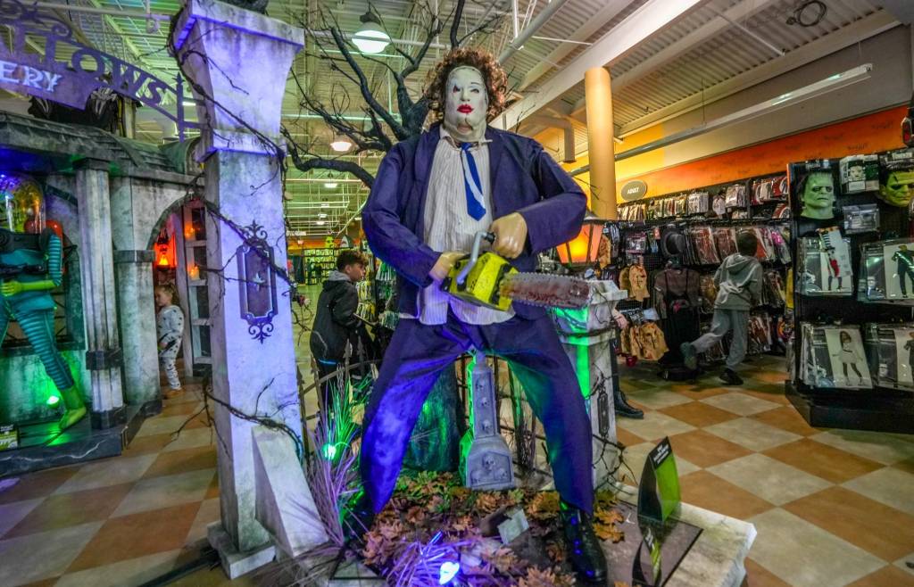 Families shopping at a Spirit Halloween store in Providence, R.I., in 2023 with celebrities Beryl Cook and Michael Berryman present