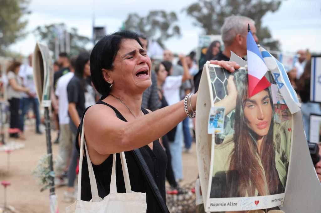 Families of victims killed at the Supernova music festival attend a gathering in memory of their relatives