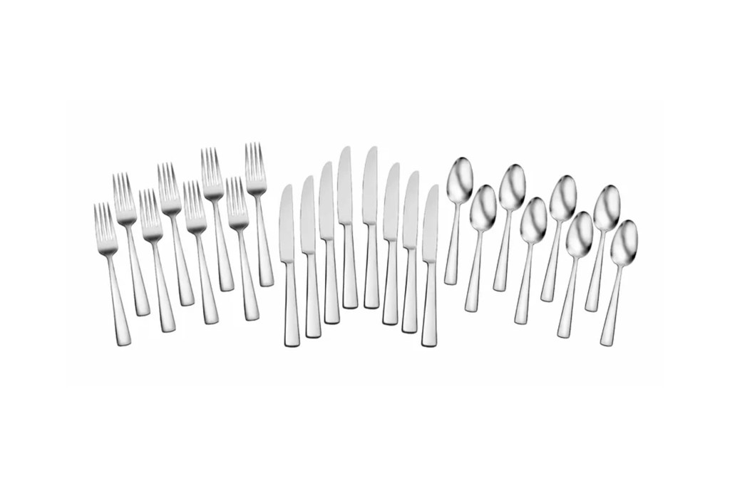 A group of silverware with knives and spoons