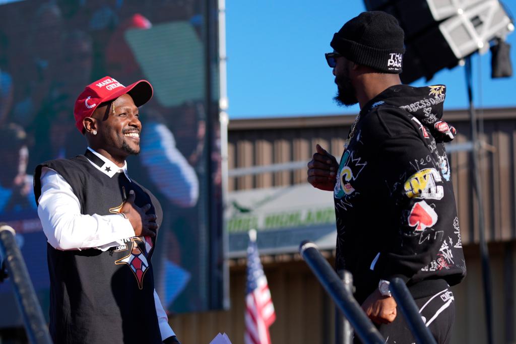 Former Pittsburgh Steelers Antonio Brown, left, and Le'Veon Bell, arrive before Republican presidential nominee former President Donald Trump speaks during a campaign rally at Arnold Palmer Regional Airport.