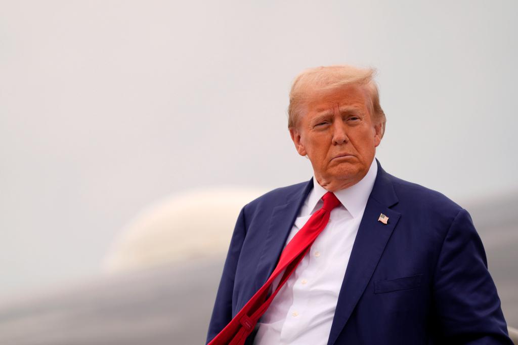 Former President Donald Trump disembarks from his plane at the Augusta Regional Airport on Friday, Oct. 4, 2024. 