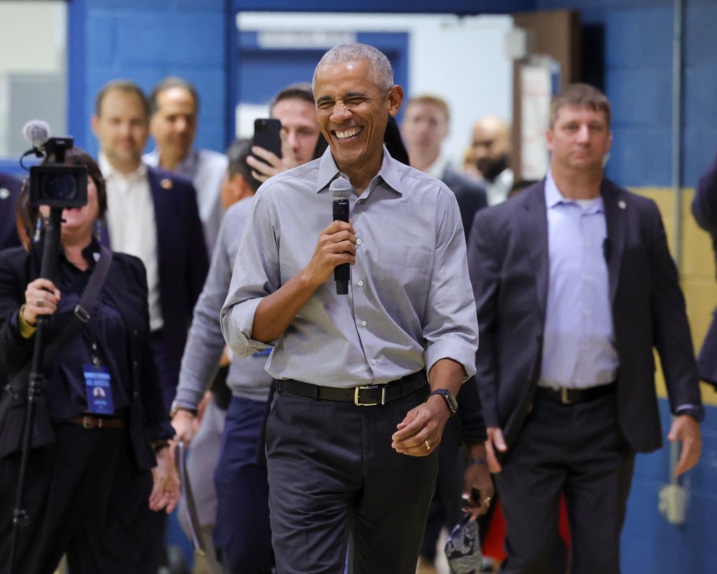 Former US President Barack Obama walks out to surprise an overflow audience before speaking at a get-out-the-vote rally on the first day of early voting at the Cheyenne High School on October 19, 2024 in North Las Vegas, Nevada.