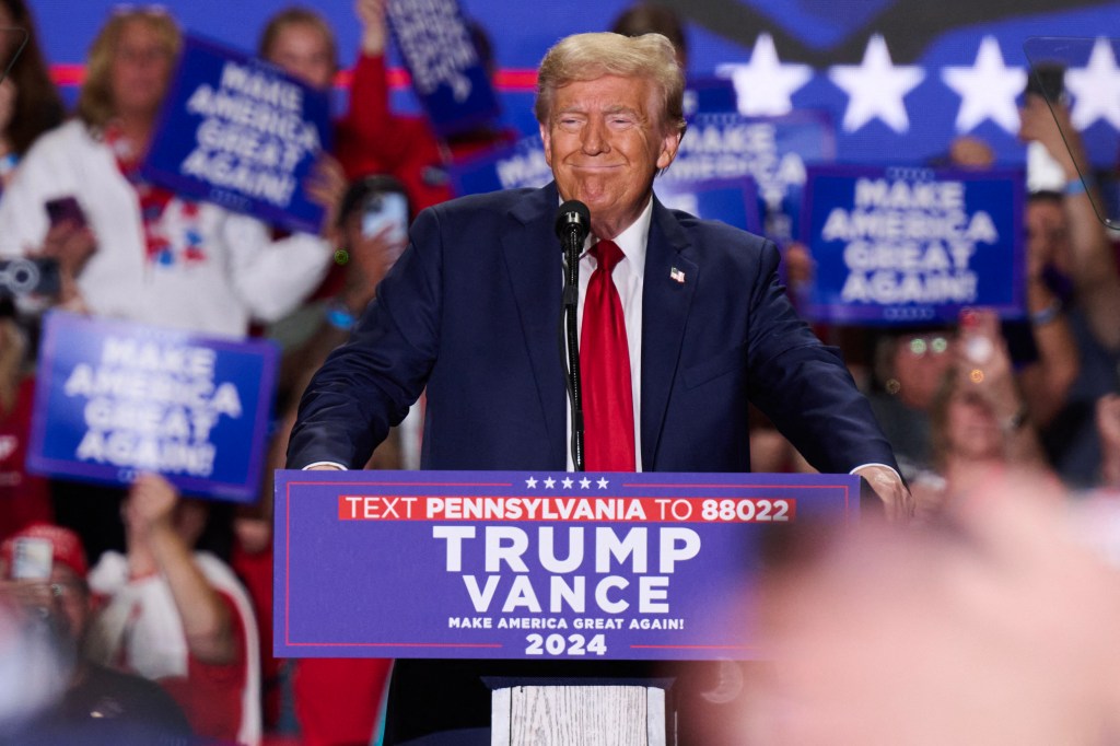 Former U.S. President Donald Trump speaking at a podium during a campaign event at the Bayfront Convention Center in Erie, Pennsylvania, on September 29, 2024.